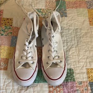 White high top Converse All Stars.